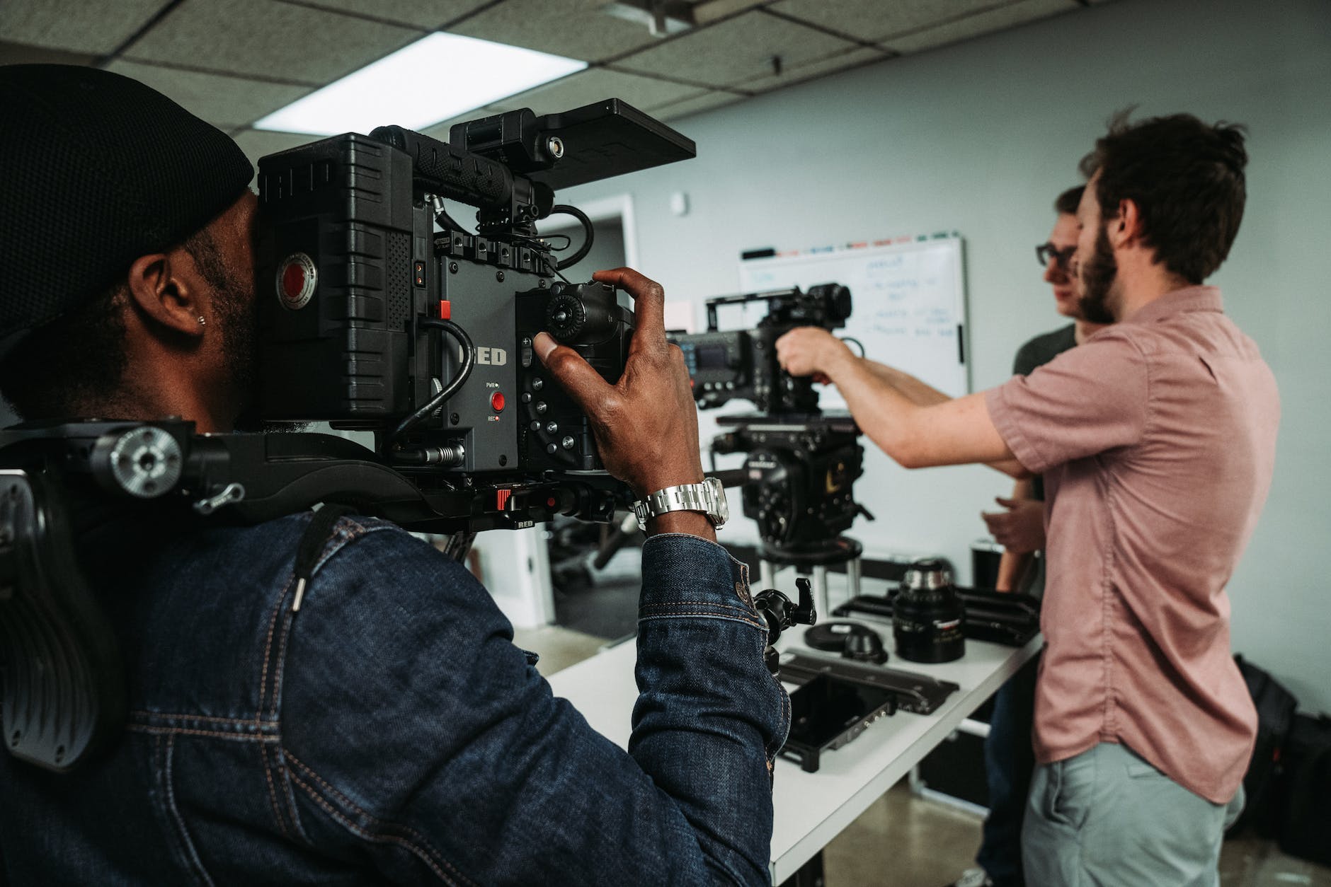man using a professional video camera